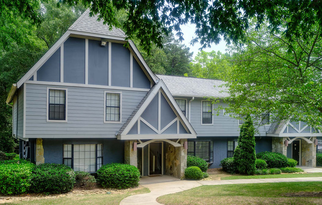 the front of a house with a blue and white house