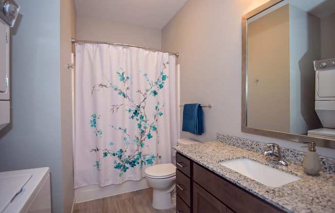 Bathroom with Stacked Washer and Dryer