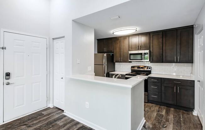 a kitchen with a sink and a refrigerator
