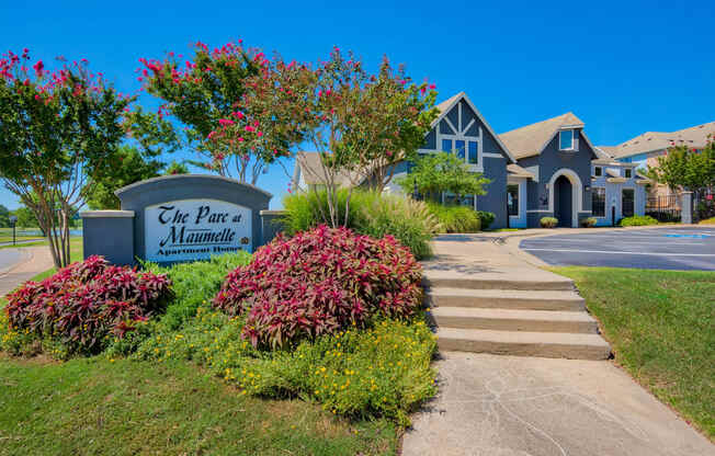 a home with a sign that says the port of miami and a driveway with stairs leading