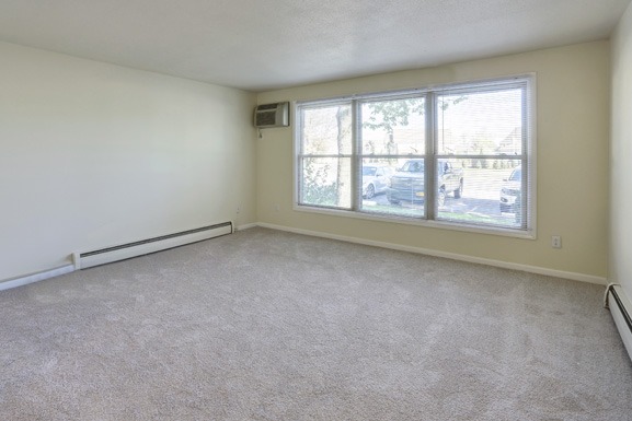 an empty living room with a large window