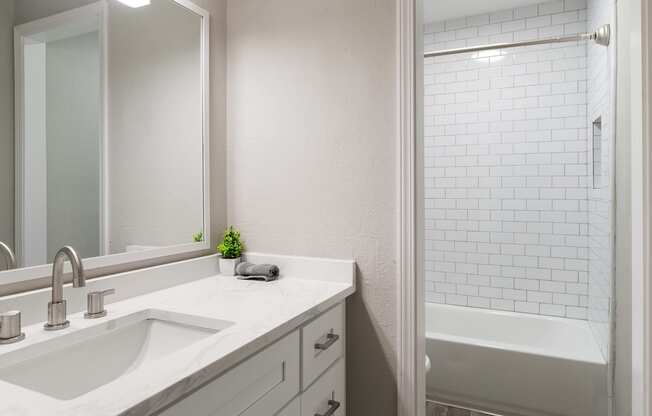 the preserve at ballantyne commons apartment bathroom with sink and shower