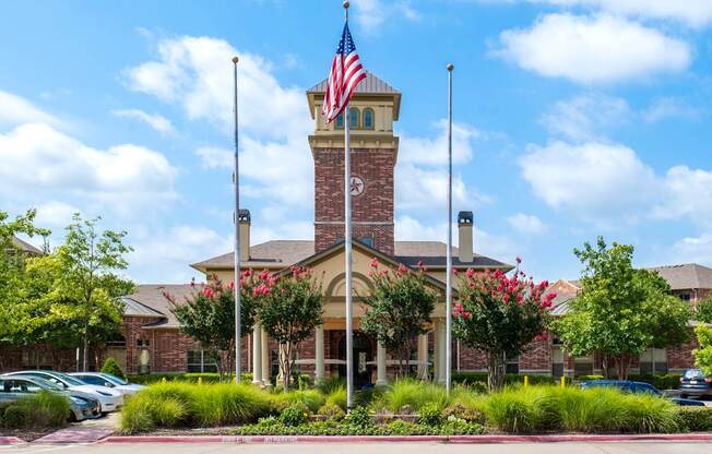 A building with a flag on top and a clock tower.