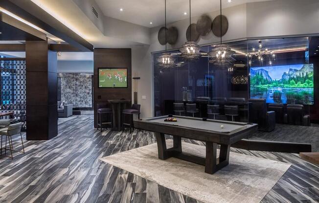 pool table and movie theater in clubhouse