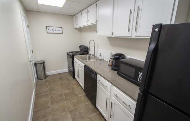 This is a photo of the kitchen in the resident social room at Park Lane Apartments in Cincinnati, OH.