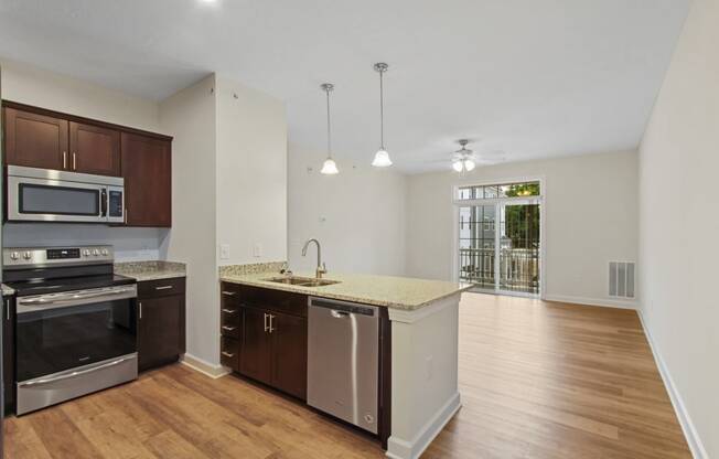 Kitchen sink and stove at Hadley Place Apartments, Enola