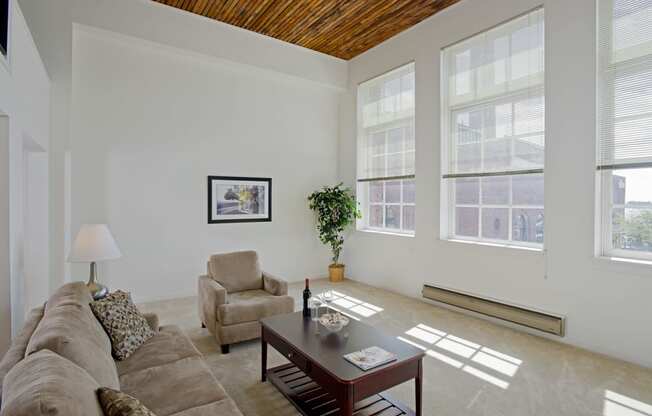 a living room with a couch and a coffee table at Tindeco Wharf, Maryland, 21224