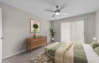 an empty bedroom with a bed and a ceiling fan