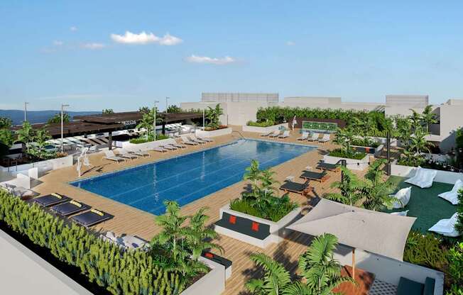 A large outdoor swimming pool surrounded by lounge chairs and greenery. at Elements Apartments*, Irvine, CA