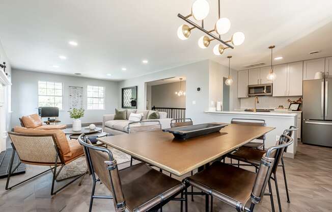large dining table next to the resident kitchen in Littlestone Apartments community lounge
