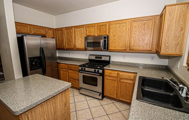 Great 4 Bedroom 2 1/2 Bath home that features a Strip View from the Master Bedroom, a Large Open kitchen. Move in ready