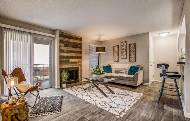 a living room filled with furniture and a large window