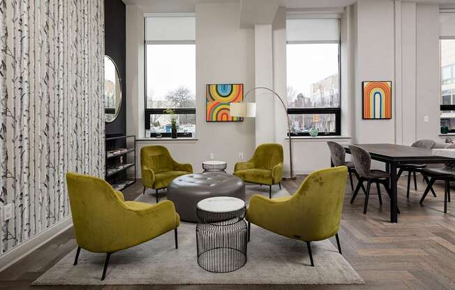 Bright and airy communal seating area with mid-century modern furniture in one of the top apartment buildings in Rittenhouse Square.