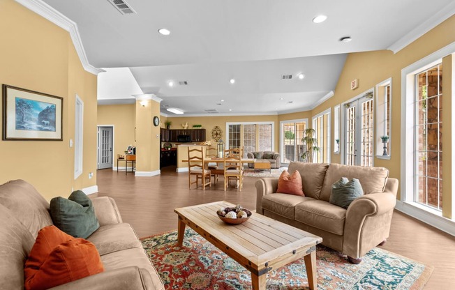 a living room with couches and a coffee table