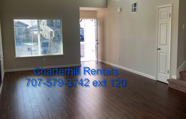 Light and bright, like new Coffey Park home with hardwood style flooring and beautiful yard