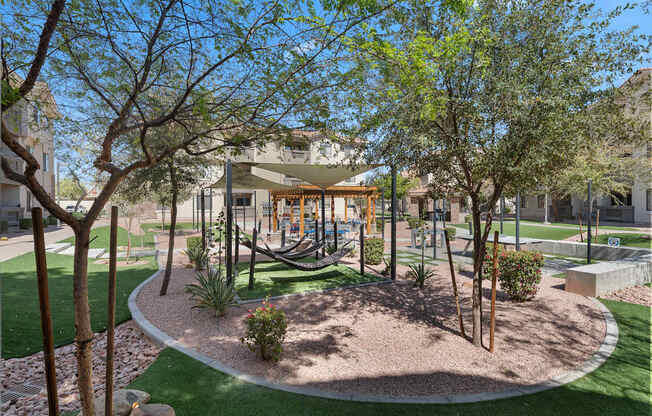 A playground with a swing set and a slide.