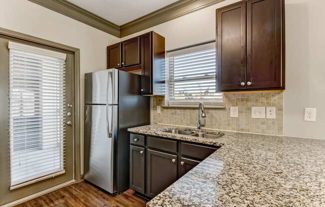 Fully-Equipped Kitchen with Granite Countertops
