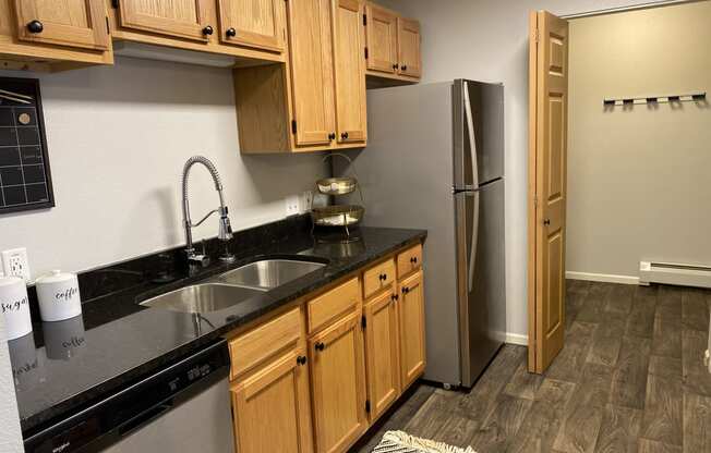 a kitchen with a sink and a refrigerator