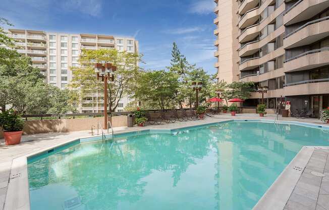a large swimming pool in the middle of two apartment buildings