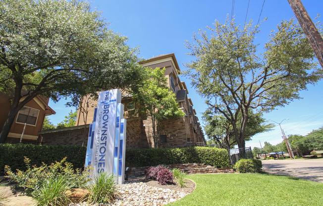 This is a photo of the monument sign/grounds at The Brownstones Townhome Apartments in Dallas, TX.