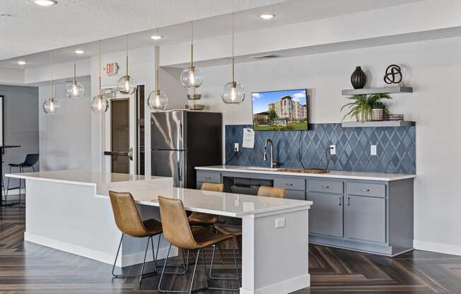 a kitchen with a white counter top and blue cabinets