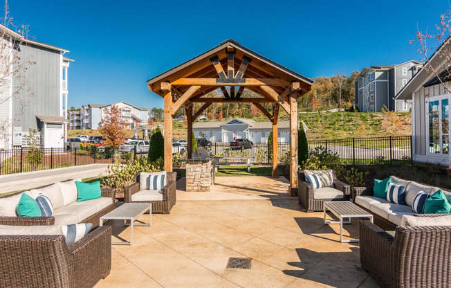 the outdoor patio of a home with chairs and a gazebo at Village at Westland Cove Apartments, Knoxville, 37922