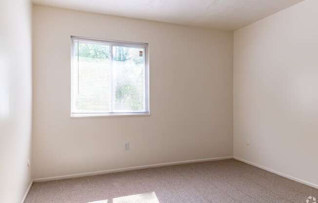 an empty room with a window in it