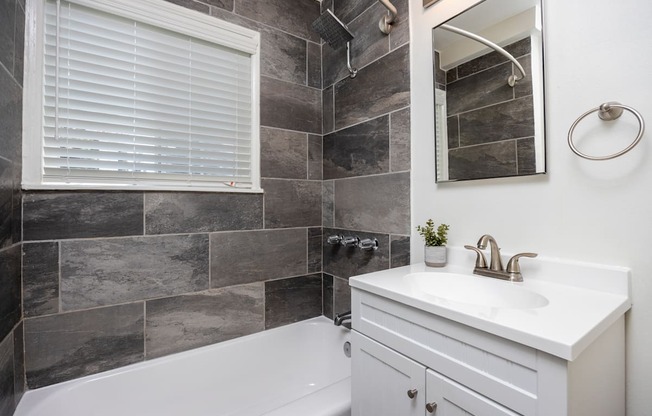 a bathroom with a sink and a bathtub