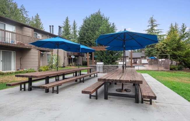 Picnic Tables with Umbrellas at North Creek Apartments, Washington