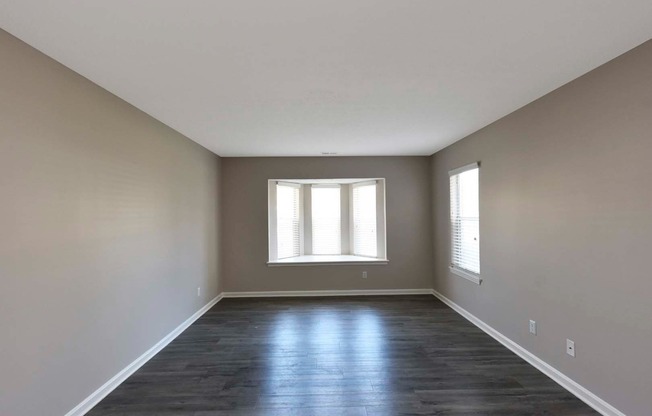 Spacious Living Room + Bay Window