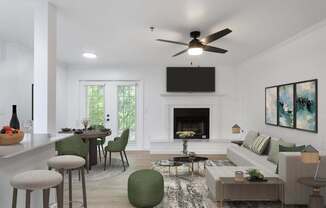 A modern living room with a fireplace and a flat screen TV mounted above it.