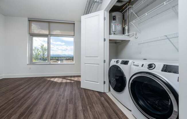 A laundry room with a washer and dryer in it.