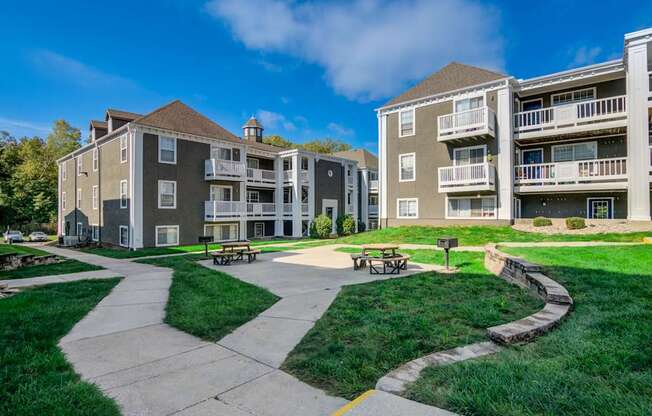 A sunny day at a residential complex with a clear blue sky.