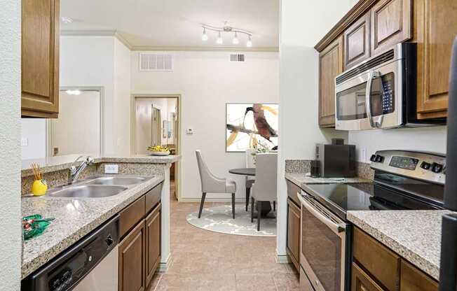 A kitchen with a black stove top oven.