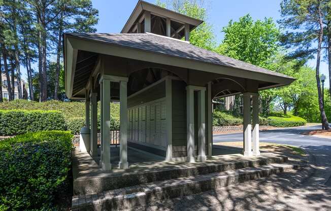 Mail station at Wynnwood Vinings Atlanta with trees and bushes in the background