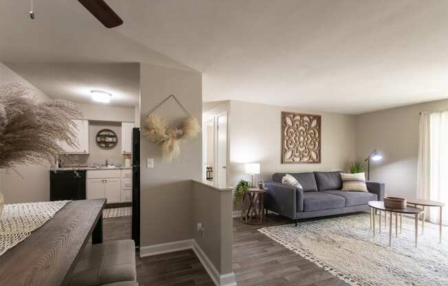 This is picture of the kitchen and living room from the entryway in the 823 square foot 2 bedroom apartment at Aspen Village Apartments in the Westwood neighborhood of Cincinnati, OH.