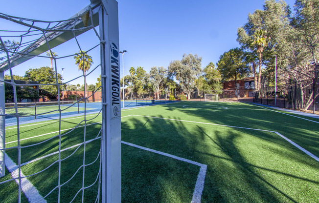 a soccer field with a net on top of it