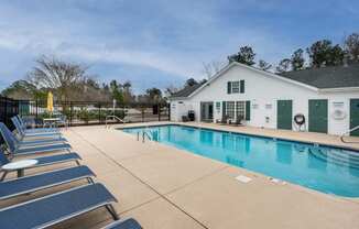 sparkling swimming pool with large lounging area