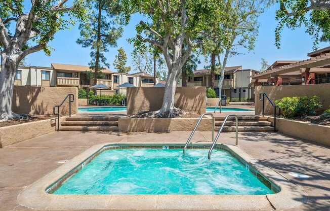 A small pool with a ladder in the middle of it.