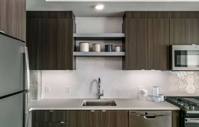 a kitchen with a sink and a refrigerator