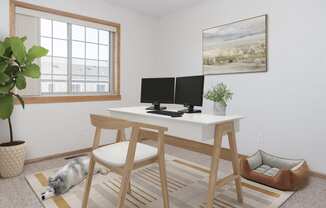 a home office with a dog sleeping on the floor