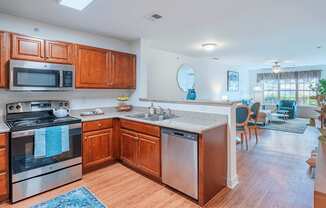 A kitchen with wooden cabinets and stainless steel appliances.