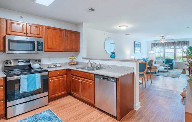 A kitchen with wooden cabinets and stainless steel appliances.