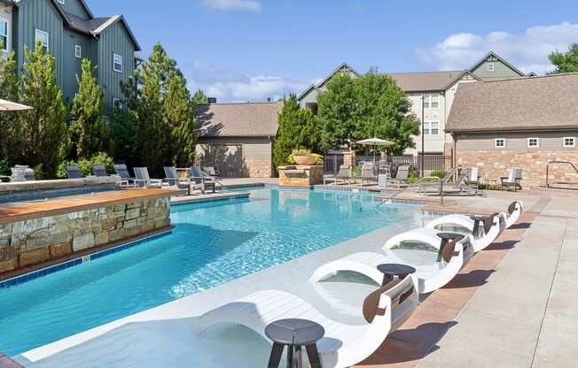 swimming pool with aqua ledge at Berkshire Aspen Grove apartments