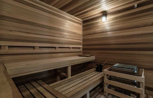 a sauna with wooden benches and a table at Altis Grand Suncoast, Florida