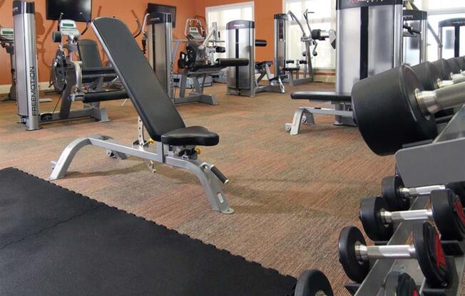 Fitness Center With Yoga/Stretch Area at Four Seasons Apartments & Townhomes, North Logan, UT