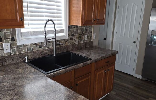 Spacious 4 Bedroom Home with Garage on Corner Lot