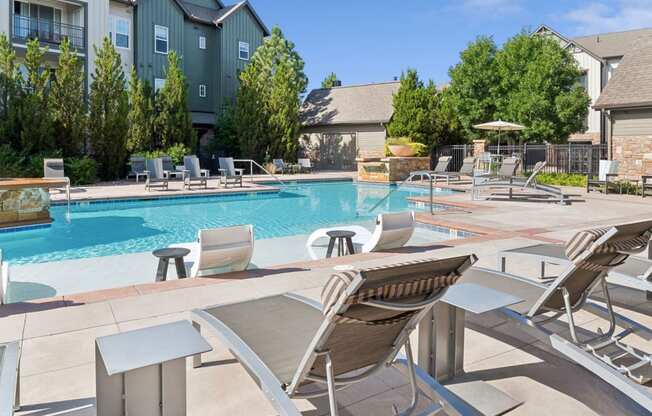 swimming pool with sun deck at Berkshire Aspen Grove apartments