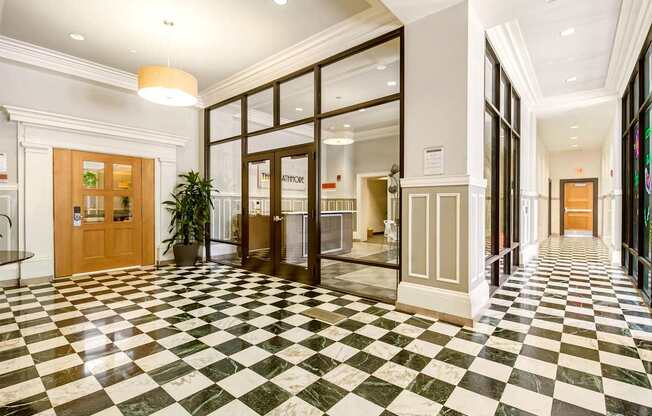 A hallway with a black and white checkered floor.