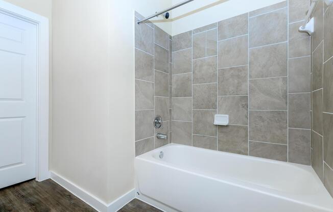 Apartments in Leander TX - Hills at Leander Expansive Bathroom with a Large Vanity, Shower, and Much More